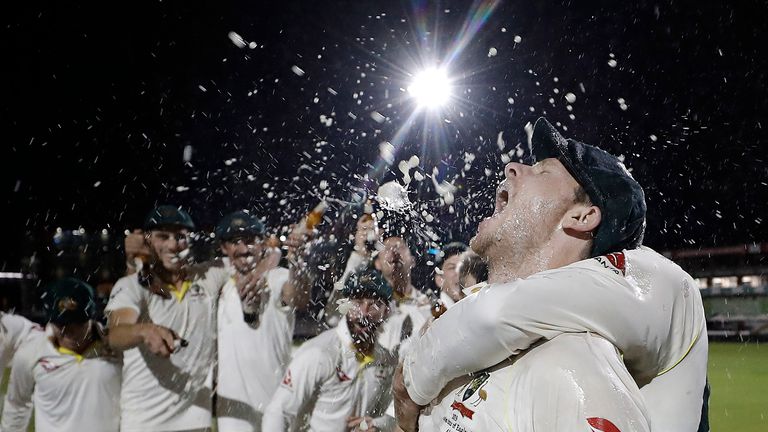 Steve Smith of Australia celebrates with team mates while singing the team song on the pitch after Australia claimed victory to retain the Ashes during day five of the 4th Specsavers Test between England and Australia at Old Trafford on September 08, 2019 in Manchester, England. 