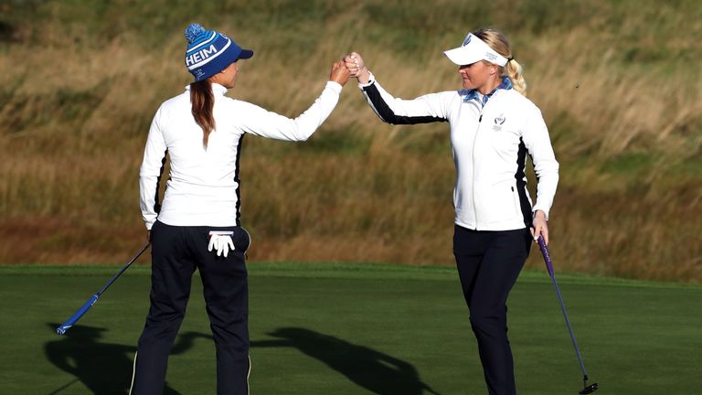 Azahara Munoz (L) and Charley Hull (R) of Team Europe on the second day of the Solheim Cup