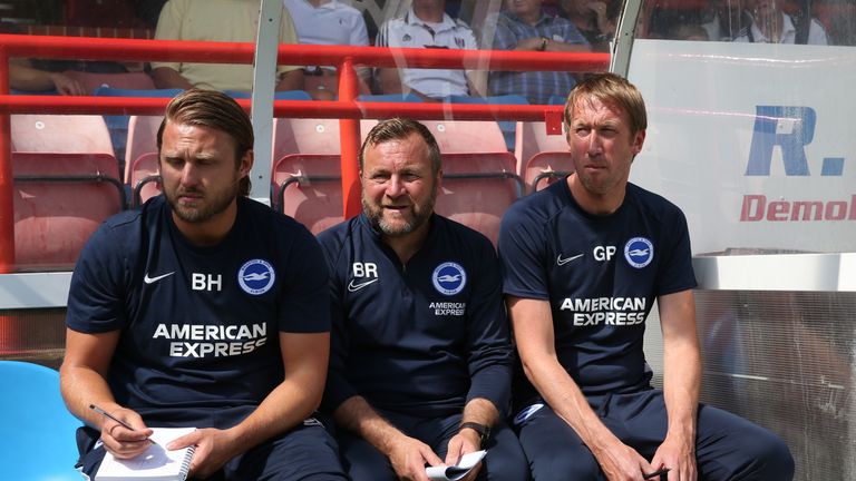 Bjorn Hamberg (first-team coach), Billy Reid (assistant head coach) and Graham Potter (manager) on the bench for Brighton and Hove Albion