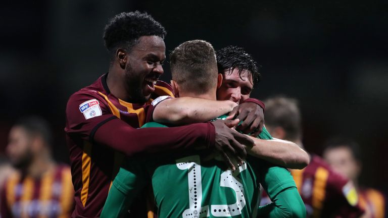 Bradford City's Sam Hornby goalkeeper is congratulated by team mates after the victory