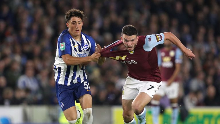 Brighton's Haydon Roberts and Aston Villa's John McGinn battle for the ball