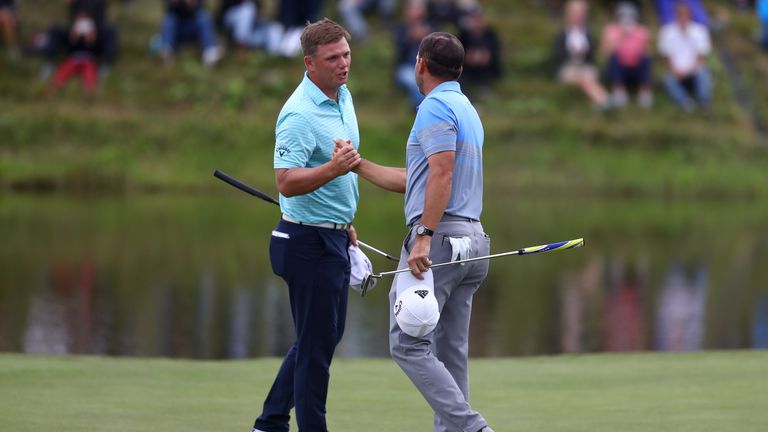 Callum Shinkwin and Sergio Garcia shake hands at the 18th on the KLM Open