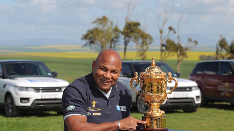 Rugby World Cup 1995 winner Chester Williams takes the Webb Ellis Cup  to a school in Protem in 2014 during the Rugby World Cup Trophy Tour ahead of the 2015 tournament