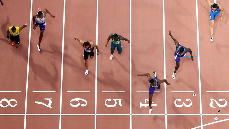 DOHA, QATAR - SEPTEMBER 28: Christian Coleman of the United States, gold, Justin Gatlin of the United States, silver and Andre De Grasse of Canada, bronze, cross the finish line in the Men's 100 Metres final compete in the Men's 100 Metres final during day two of 17th IAAF World Athletics Championships Doha 2019 at Khalifa International Stadium on September 28, 2019 in Doha, Qatar. (Photo by Richard Heathcote/Getty Images)