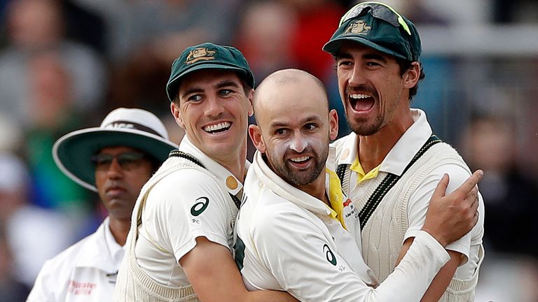 Nathan Lyon (C) celebrates the wicket of Jofra Archer with Pat Cummins and Mitchell Starc