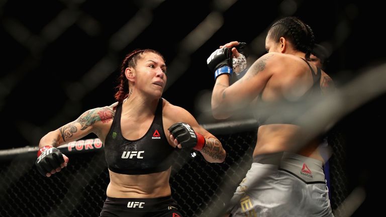 Cris Cyborg of Brazil (left) is punched by Amanda Nunes (right) during a Women's Feather weight bout during the UFC 232 event inside The Forum on December 29, 2018 in Inglewood, California.
