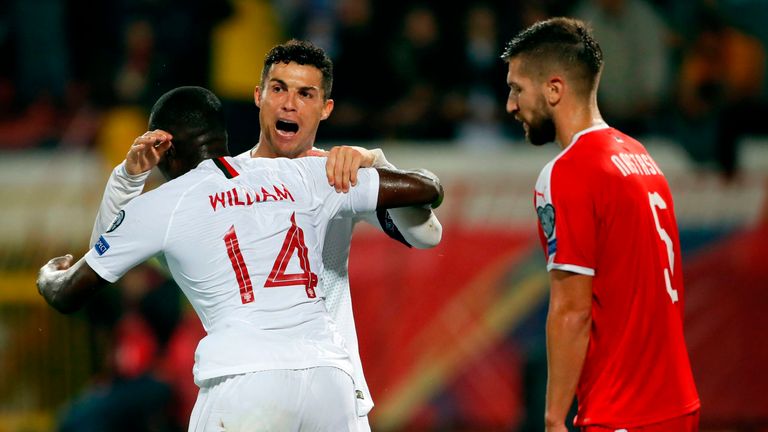 Portugal's Cristiano Ronaldo celebrates a goal with his team-mate William Carvalho