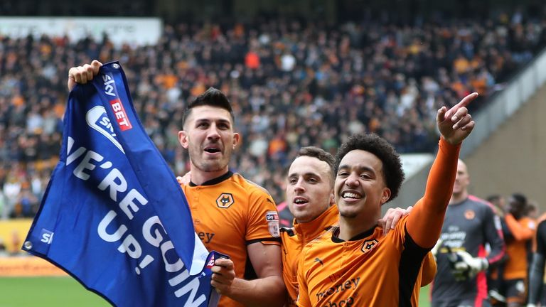 Danny Batth of Wolverhampton Wanderers celebrates promotion to the Premier League after the Sky Bet Championship match between Wolverhampton Wanderers and Birmingham City