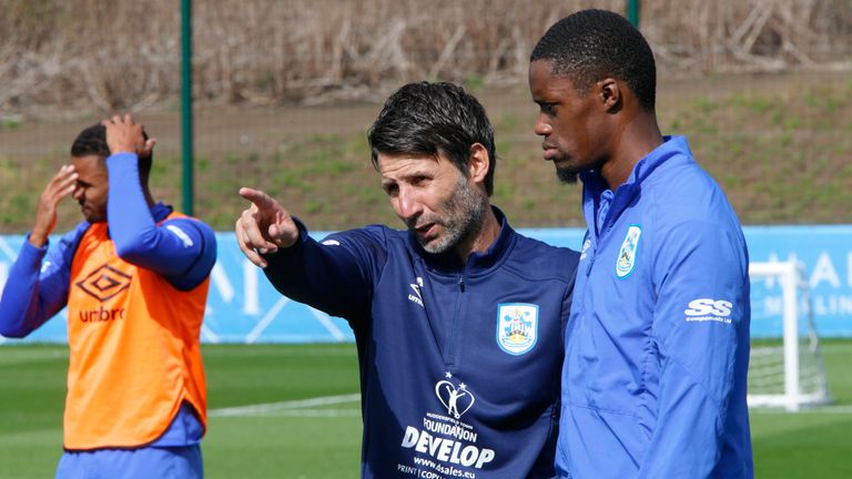 Danny Cowley speaks with Adama Diakhaby during his first training session as the new manager of Huddersfield Town