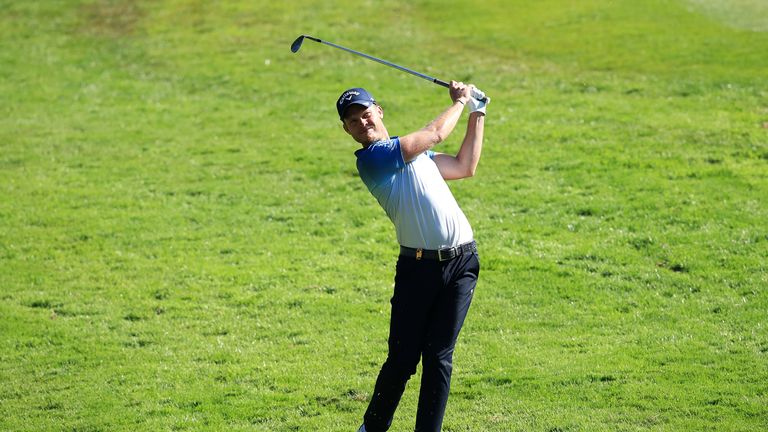 Danny Willett reclaimed a share of the lead with a birdie at the last
