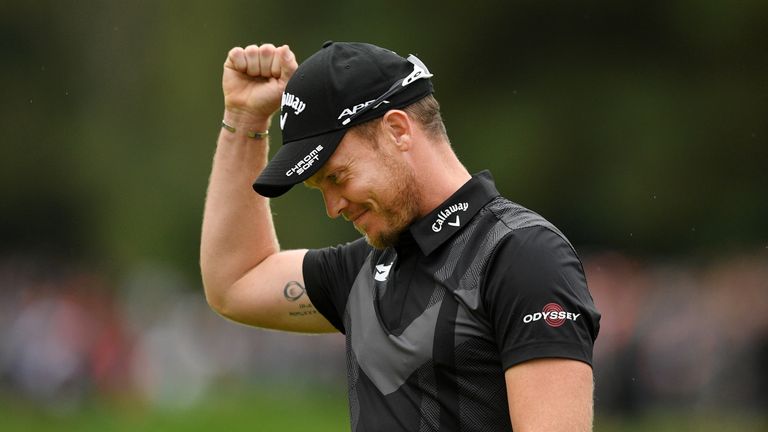 Danny Willett celebrates victory on the 18th green at Wentworth