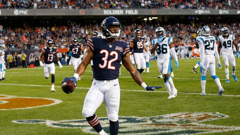 David Montgomery of the Chicago Bears completes a touchdown against the Carolina Panthers during pre-season