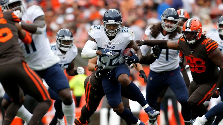 Derrick Henry of the Tennessee Titans carries the ball during the fourth quarter of the game against the Cleveland Browns