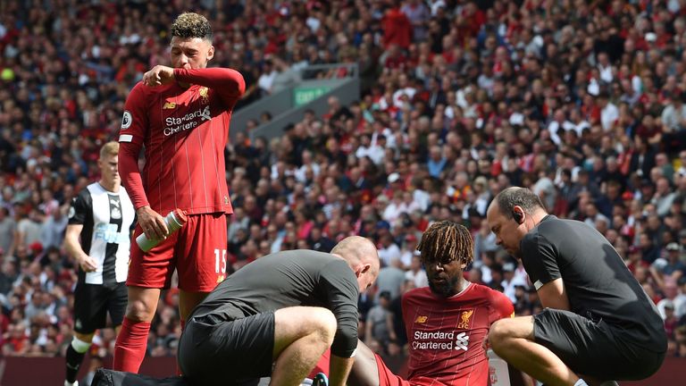 Divock Origi receives medical attention during Liverpool's Premier League match vs Newcastle