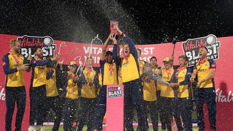 Essex's Ravi Bopara and captain Simon Harmer lift the Vitality Blast trophy after beating Worcestershire
