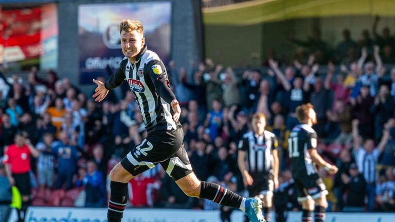 Ethan Robson celebrates his match-winning strike against Macclesfield