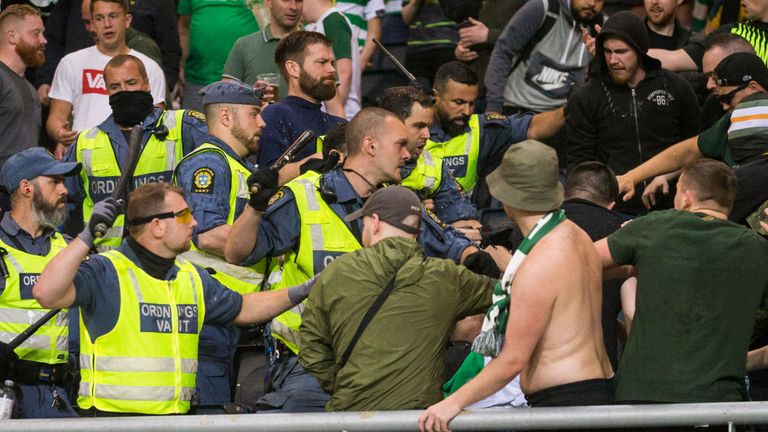 Supporters clash with police at AIK's stadium during the Europa League qualifier