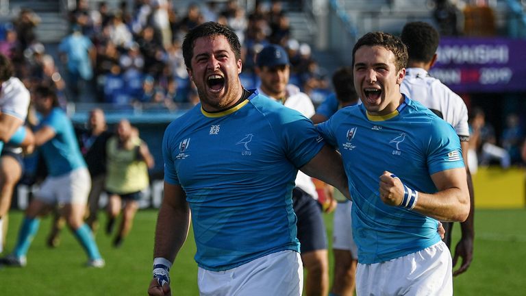 Uruguay's full back Felipe Etcheverry (R) and Uruguay's prop Facundo Gattas celebrate after winning the Japan 2019 Rugby World Cup Pool D match between Fiji and Uruguay at the Kamaishi Recovery Memorial Stadium in Kamaishi on September 25, 2019