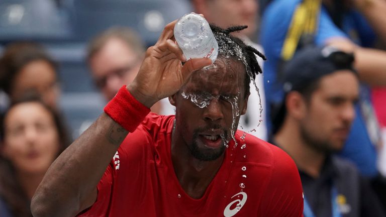 Gael Monfils from France washs his face as he plays against Matteo Berrettini from Italy during their Men's Singles Quarterfinals match at the 2019 US Open at the USTA Billie Jean King National Tennis Center in New York on September 4, 2019.