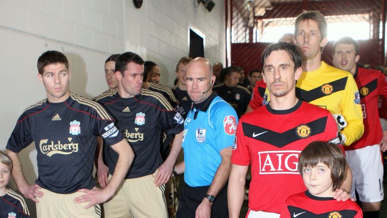 MANCHESTER, ENGLAND - MARCH 21: Gary Neville of Manchester United and Steven Gerrard of Liverpool line up in the tunnel ahead of the FA Barclays Premier League match between Manchester United  and Liverpool at Old Trafford on March 21 2010 in Manchester, England. (Photo by John Peters/Manchester United via Getty Images)