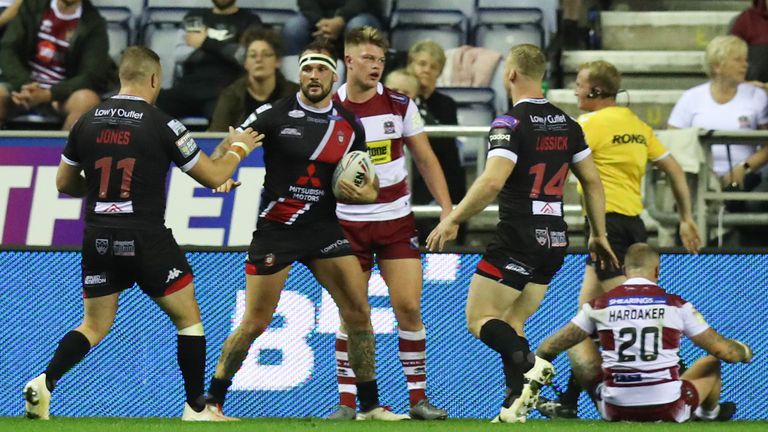 George Griffin celebrates his try for Salford