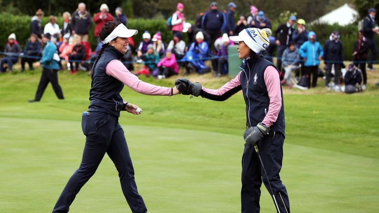 Team Europe's Georgia Hall (left) and Team Europe's Celine Boutier celebrate on the 10th green during the second day of the Solheim Cup