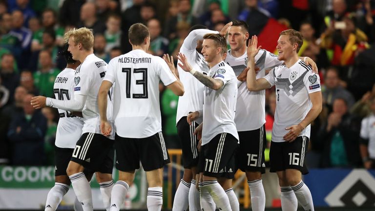 Marcel Halstenberg of Germany celebrates with teammates after scoring his team&#39;s first goal 