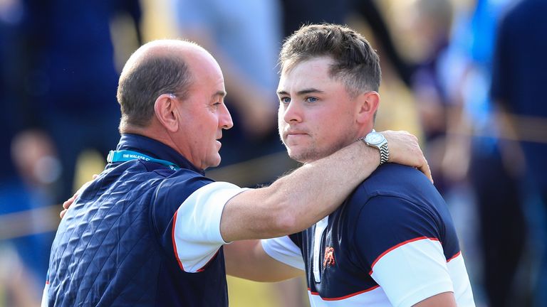 Great Britain and Ireland's Craig Watson consoles Alex Fitzpatrick after he loses his singles match at the Walker Cup