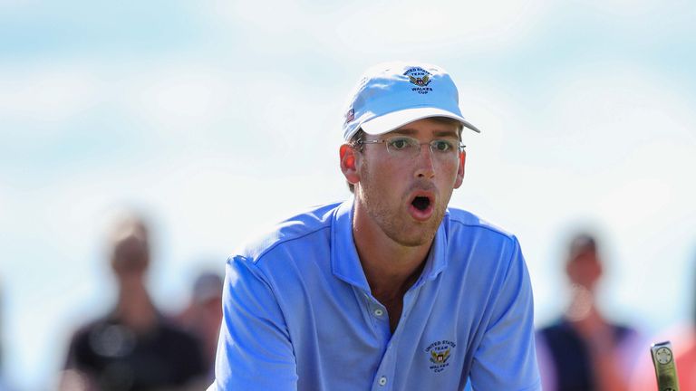 USA's Andy Ogletree reacts to a missed putt on the 17th green during day two of the 2019 Walker Cup