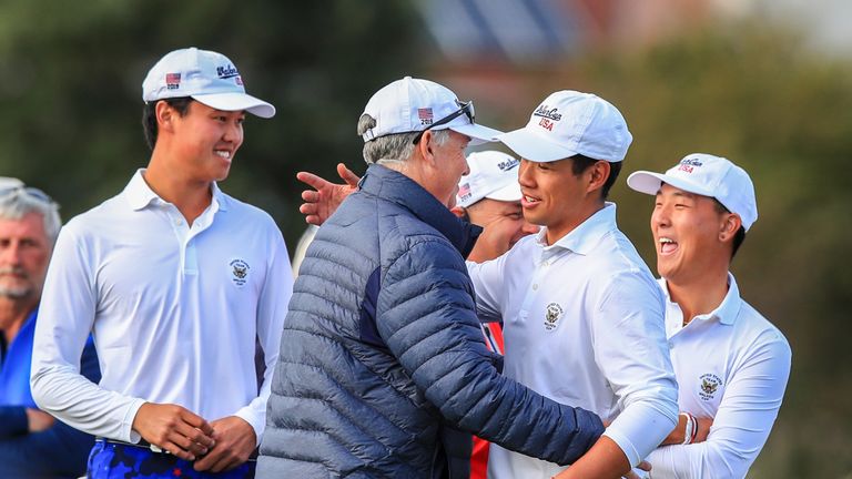 USA captain Nathaniel Crosby celebrates with his players after retaining the Walker Cup