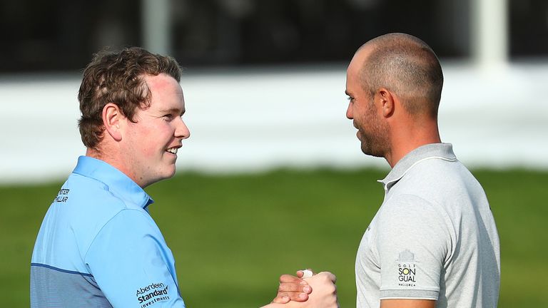 Robert MacIntyre shakes hands with Bernd Ritthammer after round three of the European Open in Hamburg