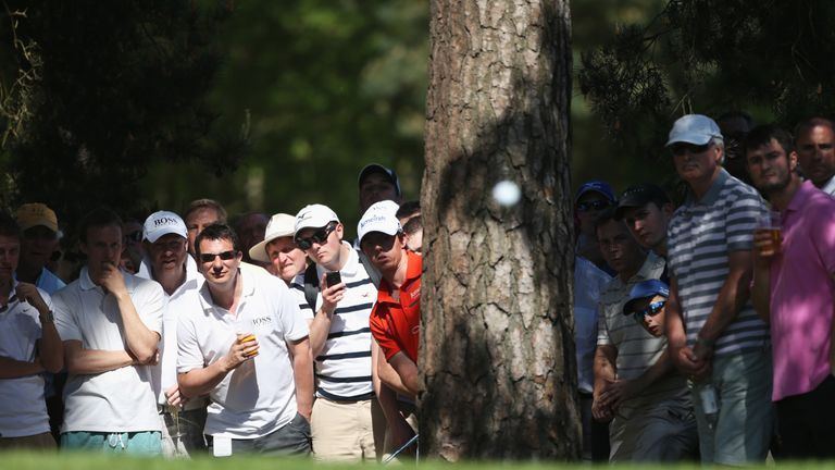 Rory McIlroy hits from behind a tree to the 10th green during the second round of the 2012 BMW PGA Championship
