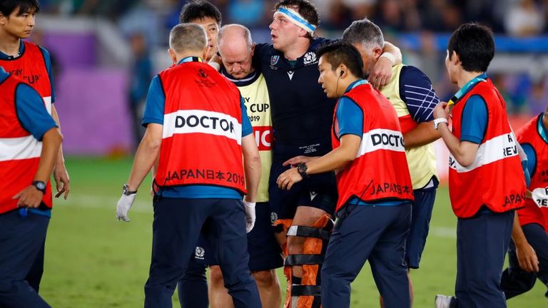 Hamish Watson is helped from the field after a serious-looking knee injury