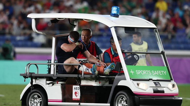 Scotland's flanker Hamish Watson is taken off the pitch to receive medical attention during the Japan 2019 Rugby World Cup Pool A match between Ireland and Scotland at the International Stadium Yokohama in Yokohama on September 22, 2019. (Photo by Behrouz MEHRI / AFP) (Photo credit should read BEHROUZ MEHRI/AFP/Getty Images)