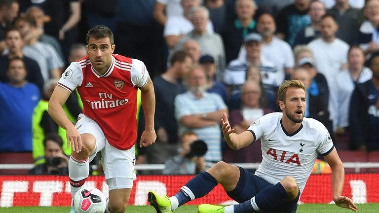 Harry Kane appeals for a penalty after going down under pressure from Sokratis