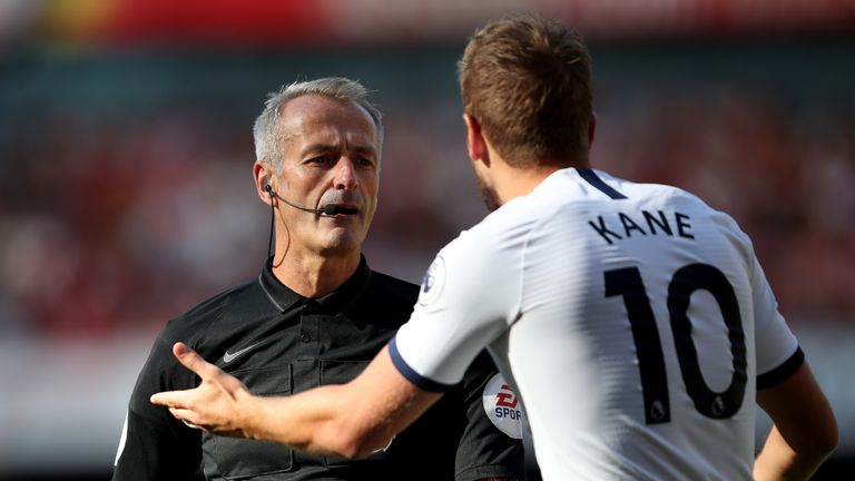 Kane protests with referee Martin Atkinson