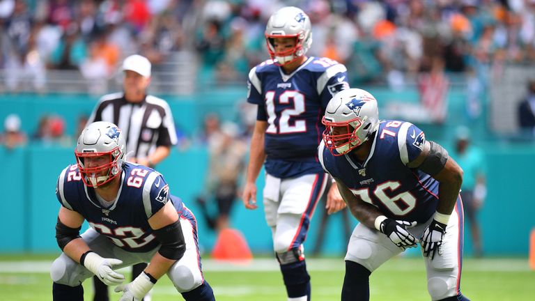 Joe Thuney and Isaiah Wynn get ready to proect Tom Brady against the Dolphins