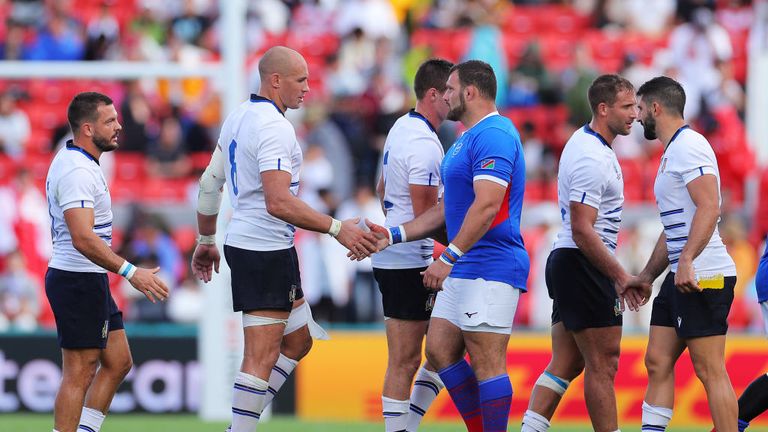 The two sides showing their respect for each other after the final whistle 