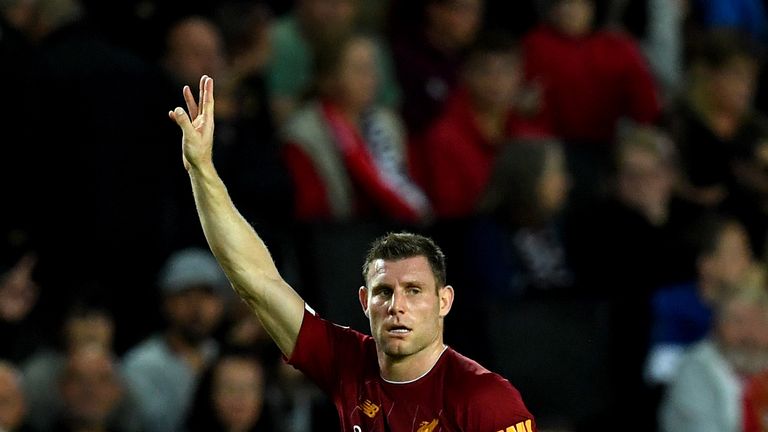 James Milner celebrates after scoring for Liverpool against MK Dons