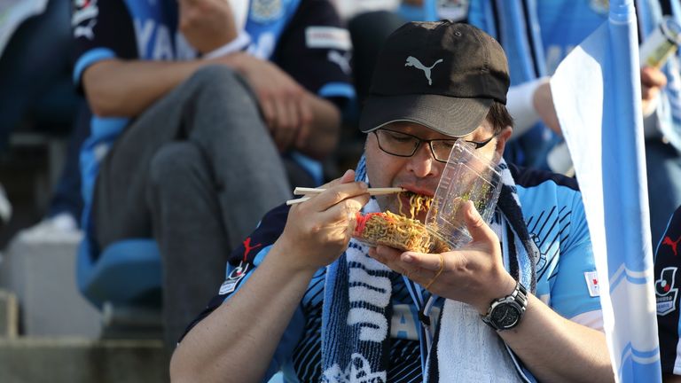 Fan eats with chopsticks at Jubilo Iwata match