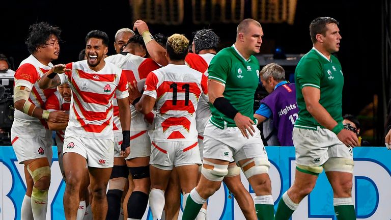 Japan celebrate their try against Ireland