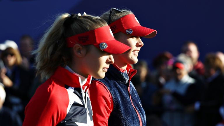 Jessica Korda and Nelly Korda of Team USA walk from the first tee