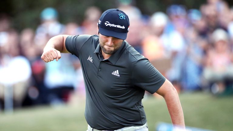Jon Rahm celebrates after making a par at the 18th during the third round of the BMW PGA Championship