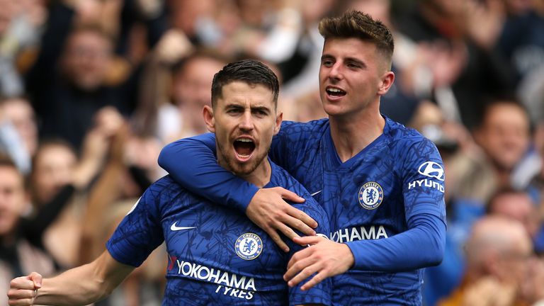 Jorginho celebrates with Mason Mount after converting his penalty