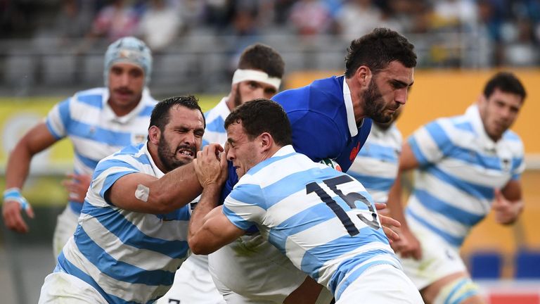 France's flanker Charles Ollivon (R) is tackled by Argentina's full back Emiliano Boffelli (R) and Argentina's prop Juan Figallo (L) during the Japan 2019 Rugby World Cup Pool C match between France and Argentina at the Tokyo Stadium in Tokyo on September 21, 2019. (Photo by FRANCK FIFE / AFP) (Photo credit should read FRANCK FIFE/AFP/Getty Images)