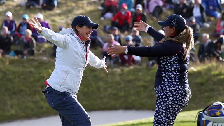 Juli Inkster celebrates with Lizette Salas after she won her Solheim Cup singles match against Anne van Dam