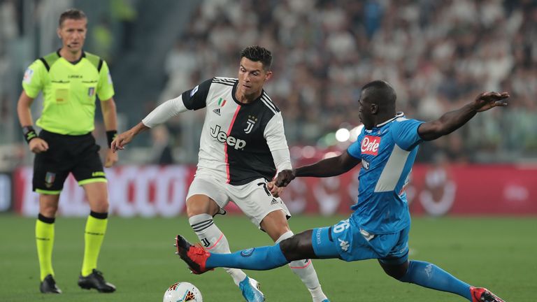 Juventus' Cristiano Ronaldo and Napoli's Kalidou Koulibaly battle for the ball during the 4-3 defeat for Ancelotti's side at the Allianz Stadium