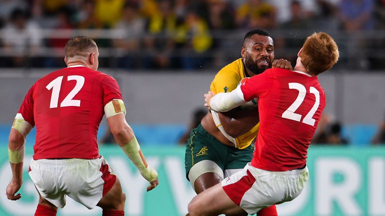 CHOFU, JAPAN - SEPTEMBER 29: Australia's Samu Kerevi penalised for leading with the arm against Wales' Rhys Patchell during the Rugby World Cup 2019 Group D game between Australia and Wales at Tokyo Stadium on September 29, 2019 in Chofu, Tokyo, Japan. (Photo by Ashley Western/MB Media/Getty Images)