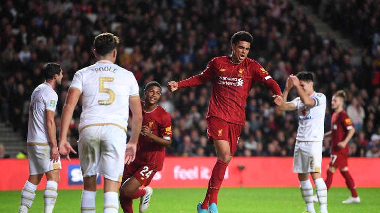 Ki-Jana Hoever of Liverpool celebrates after he scores his sides second goal during the Carabao Cup Third Round match between Milton Keynes Dons and Liverpool FC at Stadium MK