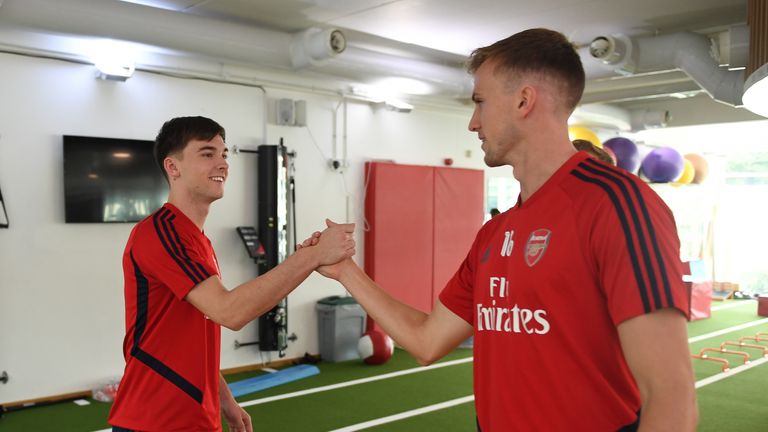 Arsenal new boy Kieran Tierney is greeted by Rob Holding